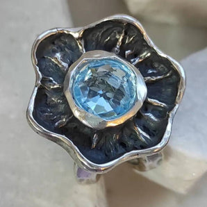 Silver Flower Ring with blue Topaz